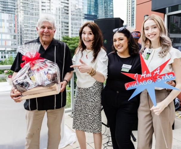 Amanda Puck, VP Mariano's/Roundy's Communications Brand Development, Mariano's Nallely Silva and Lucy Gutierrez present raffle winner Lou Rago with a basket of Mariano's goodies. (Juan Alvarez photo)