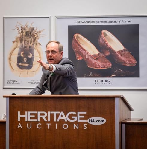 Heritage auctioneer Mike Sadler brings gavel down on Dorothy's ruby slippers, helping make this auction the most successful entertainment auction in history. (Photo courtesy of Heritage Auctions)
