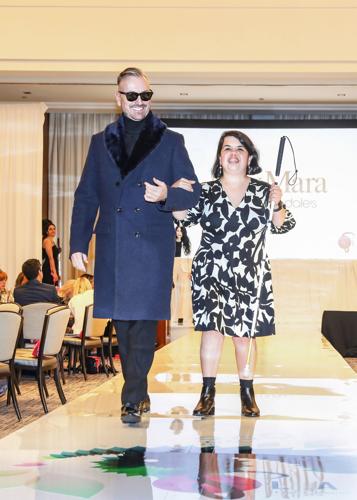 Mark Olley escorts Chicago Lighthouse's Sandy Murillo. (Photo by Mila Samokhina)