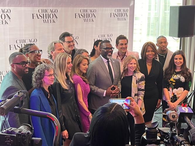 Mayor Brandon Johnson, with event organizers, announced the debut of Chicago Fashion Week coming in the fall. The Mayor is seen here posing with CFW Steering Committee members. (Photo Candace Jordan)