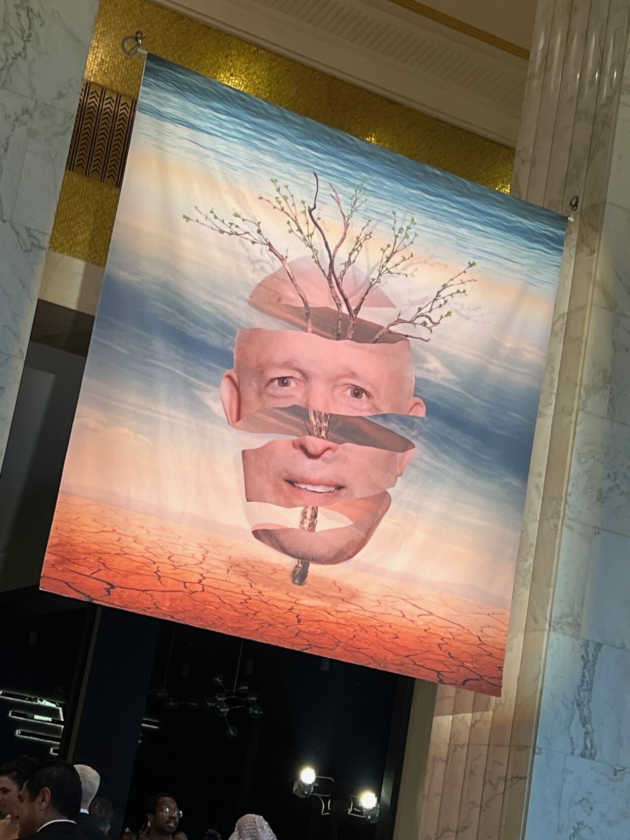 Honoree Greg Cameron shown in a surreal mural at entrance. (Photo by Candid Candace Jordan)