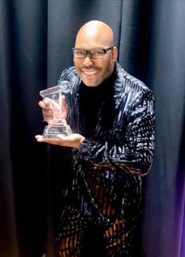 Hosea Sanders accepts his Excellence in Broadcast Award. (Photo courtesy of Hosea Sanders)