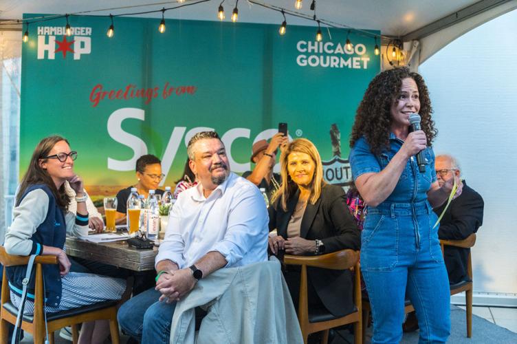 Event host Chef Stephanie Izard addresses the crowd in front of the panel of judges. (Photo courtesy of Chicago Gourmet)