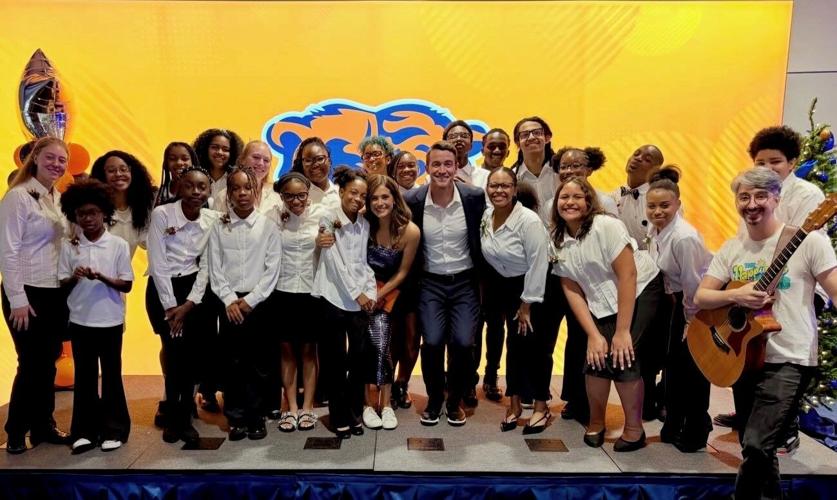 The Happiness Club poses with film's stars Robert Buckley and Lyndsy Fonseca. (Photo | Maureen Schulman)