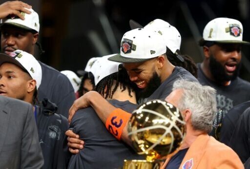 New York Knicks teammates Jalen Brunson and Karl-Anthony Towns celebrate after beating the San Antonio Spurs to capture the NBA championship