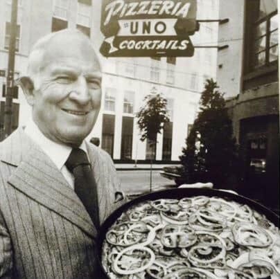 Ike Sewell, standing in front of the Original Pizzeria Uno at 29 E. Ohio with his deep dish pizza creation..jpg