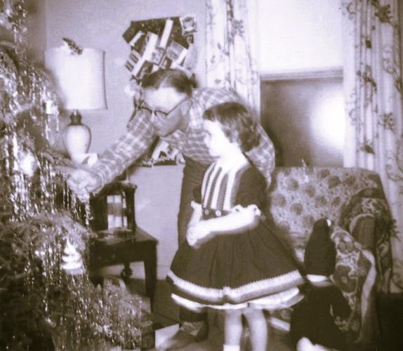Dad is introducing me to the wonder of Christmas.