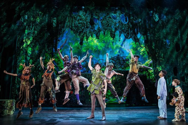 “I Won’t Grow Up!” Nolan Almeida as Peter Pan (center) and the cast of Peter Pan. (Photo } Matthew Murphy)