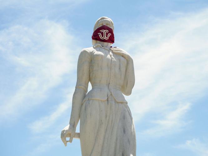 Pioneer Woman statue, masked