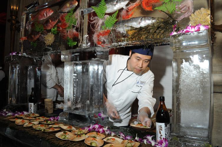 James Beard Awards 2015- Gary Zeng, from Wicker Park Seafood and Sushi,  with a wall of frozen fish at Lyric Opera House. (Photo by Candace Jordan)
