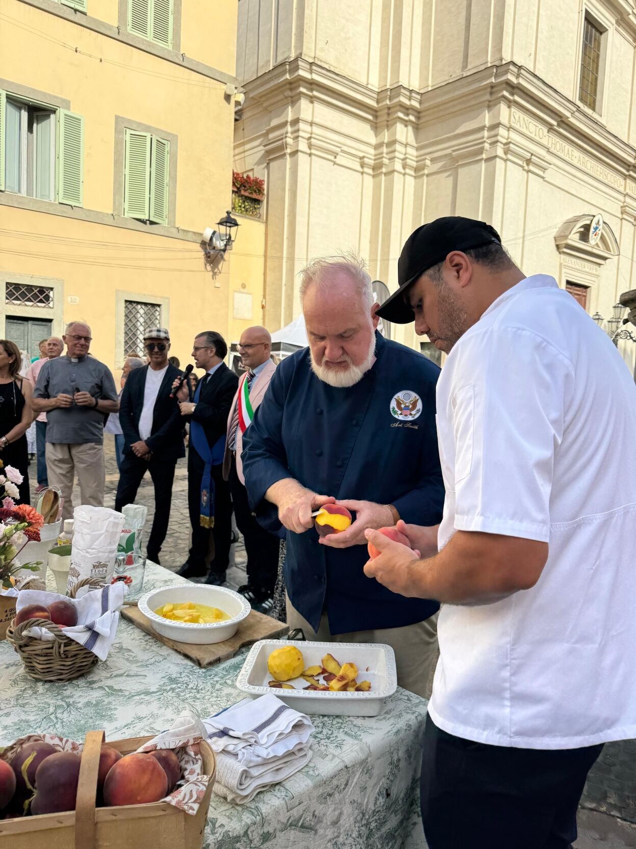 Chef Art Smith and Hector Guerrero preparing peaches for the 90th annual Peach Fest.