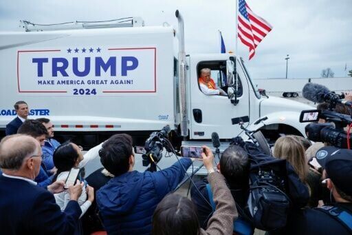 Republican presidential nominee Donald Trump holds a press conference from inside trash hauler at Green Bay Austin Straubel International Airport on October 30, 2024 in Green Bay, Wisconsin