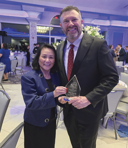 Carol Dizon and Will Harris with the Crisis Center for South Suburbia's Corporate Partnership Award. (Photo courtesy Darvin)