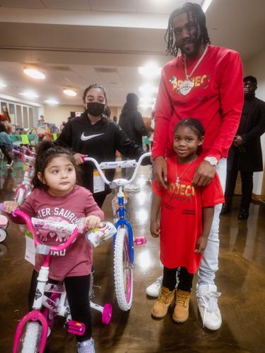 Children receive toys at Hotblock Jmoe's toy drive