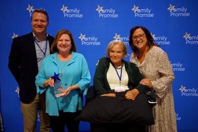 Family Promise CEO, Cheryl Schuch, Clayton Director of Philanthropy, Susan Brown and Clayton Social Responsibility Program Manager, Ted Rutland stand with Karen Olson as Clayton is awarded the 1st annual Karen Olson Impact Award from Family Promise.