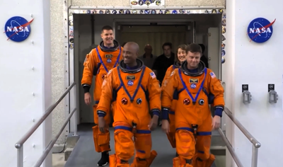 The Artemis crew enroute to the Orion rocket before liftoff. (Photo courtesy of NASA Image & Video Gallery/ images.nasa.gov/)