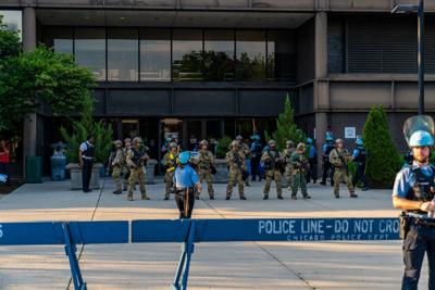 Chicago, Illinois / USA - June 4 2020: Police officer presence and National Guard at a peaceful protest and rally in downtown Chicago, West Loop Neighborhood over George Floyd Death. (Motion Loop photo for Shutterstock)
