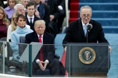 US Senate Minority Leader Chuck Schumer (right) is seeking to ratchet up the pressure on Donald Trump over the Epstein files