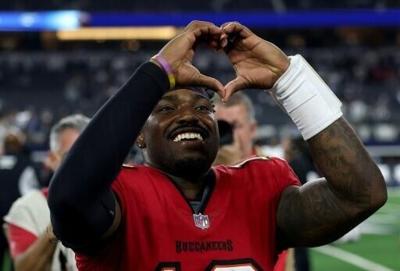 Tampa Bay quarterback Jalon Daniels celebrates after leading the Buccaneers to an upset NFL win over the Dallas Cowboys