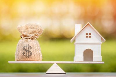 Home And Money Bag Put On The Scales With Balance Put On The Woo