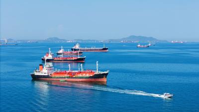 LPG gas and oil tanker ships anchored in the ocean near Strait of Hormuz. (Shutterstock photo by GreenOak)