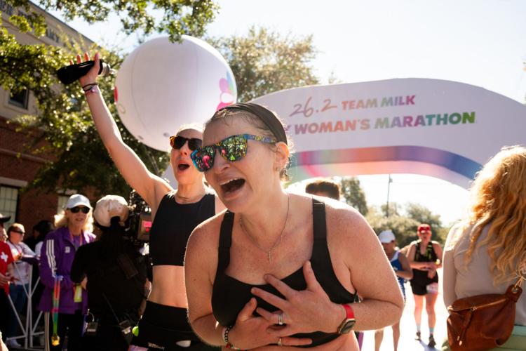 Runner crosses the finish line at the inaugural Every Woman's Marathon. Credit: MilkPEP