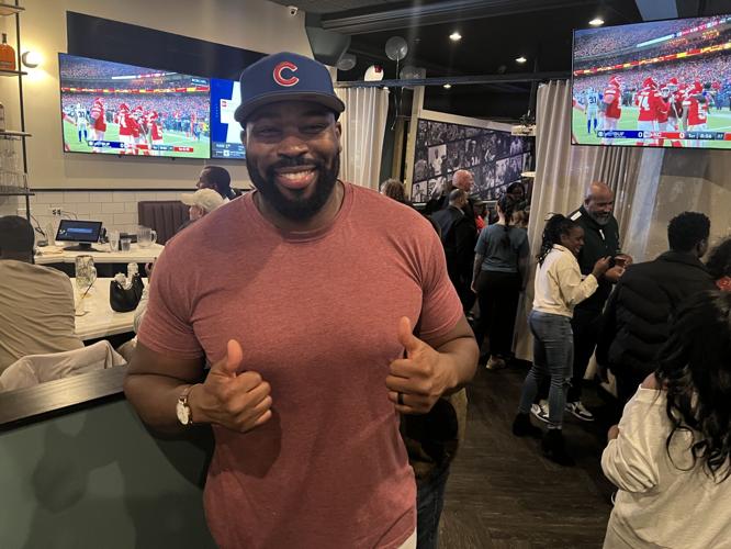 Israel Idonije is all smiles at the opening of his latest bar/restaurant, The Staley. (Photo by Candace Jordan)