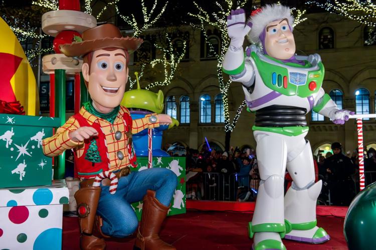 Buzz Lightyear and Woody in Wintrust Mag Mile Lights Parade 2024. (Photo courtesy of GNMAA Chicago)