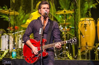 John Stamos playing the guitar for the Beach Boys at Neal S. Blaisdell Center, Honolulu, Hawaii, January 12, 2014. (Photo by Peter Chiapperino for Wikimedia Commons)