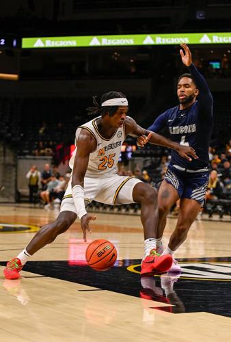 Mark Mitchell (25) pushes past guard Caleb Wright (4)