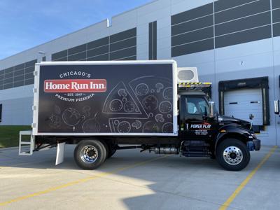 Mayor Johnson and Home Run Inn Gift Pizza to students