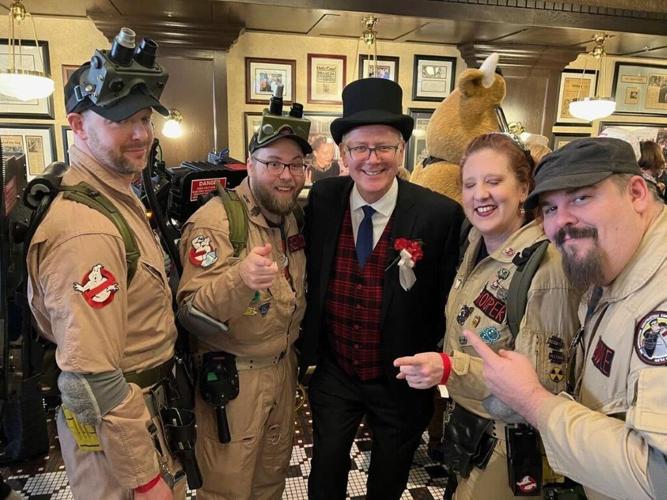 Grant DePorter, owner Harry Caray's Tavern Navy Pier, playfully poses with "Ghostbusters" at last year's Harold Ramis Day Celebration. Fans are invited for free to this year's event Monday, February 2, to honor one of the city’s most beloved creative mi...