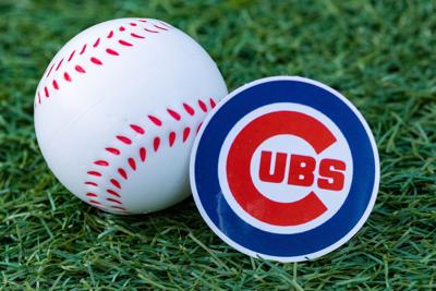 September 26, 2022, Cooperstown, New York. The emblem of the Chicago Cubs baseball club and a baseball. (Shutterstock photo)