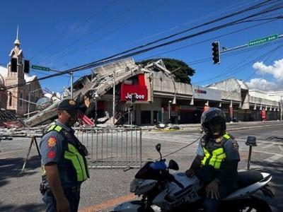 Buildings including a Jolibee restaurant collapsed following a 7.8-magnitude earthquake that hit off Mindanao island