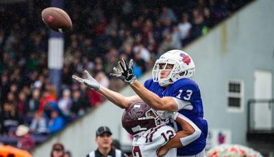 Wide receiver Jacob Slifka (13) goes for the catch over UPS' Steven Anaya.
