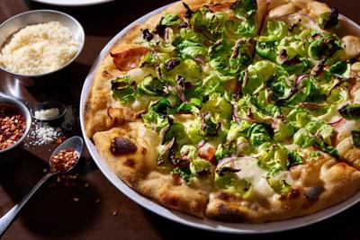 The Radicle's menu includes seafood, pizza, and late-night dining options. (Photo: Radicle website, radiclechicago.com)