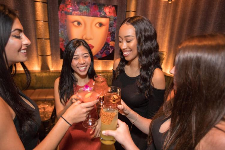 Toasting at Tao Chicago. (Choose Chicago image)