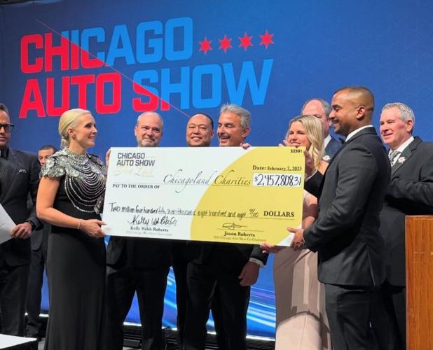 Last year's show raised over $2 million for local charities. (From L to R) Kelly Webb Roberts, CAS Chair; and Jason Roberts, Chicago Automobile Trade Association Chair present check to charities. (Photo Chicago Auto Show)