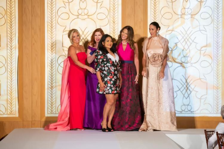 Designer Elda de la Rosa poses with her models after her segment.