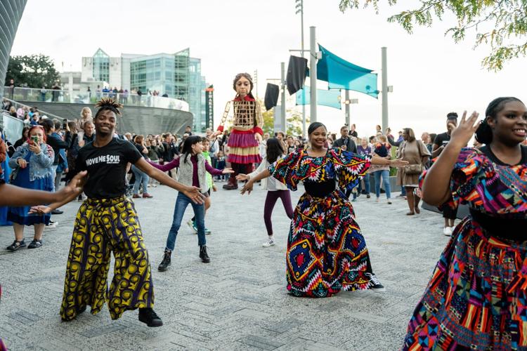 Members of Move Me Soul’s Youth Ensemble taught Amal a few dance moves as she made her way down Navy Pier. (Photo by Ty.Optix Photography)