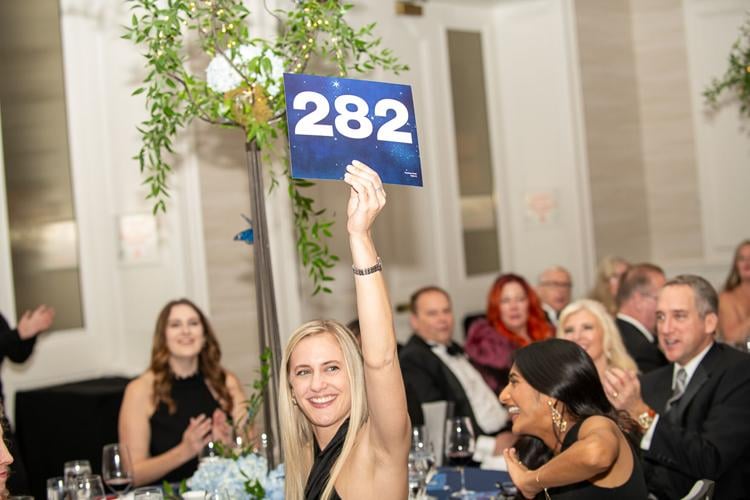 A paddle raise, live and silent auctions brought in approximately $124,000. (Photo by Patrick Nugent)