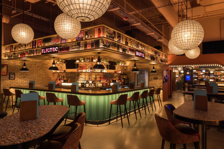 Slide into the action at River North’s state-of-the-art shuffleboard bar Electric Shuffle One