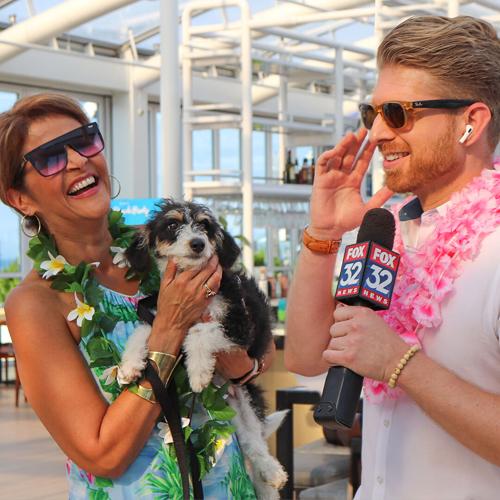 Sylvia Perez and Jake Hamilton emcees PAWS Chicago Beach Party.