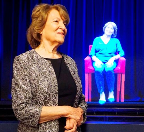 The late Fritzie Fritzshall in front of her hologram in Illinois Holocaust Museum's Survivor Stories Experience.