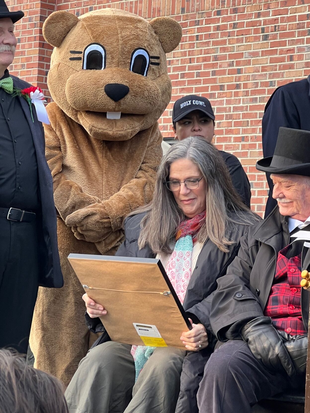 Harold Ramis' widow, Erica Mann Ramis, examines the plaque declaring it Harold Ramis Day in Chicago presented by Alderman Brendan Reilly. (Photo by Candace Jordan)