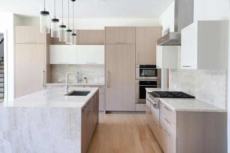 Sleek modern kitchen in former Blackhawk Adrian Aucoin's Hinsdale home that is listed for $6M. (photo | Redfin)