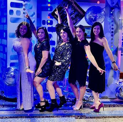 Party guests getting into the spirit of the Mag Mile Association's "Disco in the District" fundraiser.