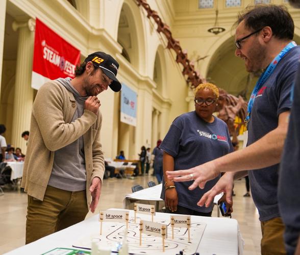 NASCAR winning driver Ray Blaney interacts with students at the NASCAR Chicago Street Race STEAM Fest at Field Museum. (NASCAR Chicago Street Race photo)