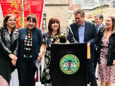Maureen and Marc Schulman, and family, celebrating the reopening of The Eli M. Schulman Playground on May 18.
