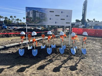 Ceremonial hard hats and shovels at groundbreaking event for The James.